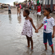 Girls hold hands as they help each other wade through a flooded street after the passing of Hurricane Matthew in Les Cayes, Haiti, Thursday, Oct. 6, 2016. Two days after the storm rampaged across the country’s remote southwestern peninsula, authorities and aid workers still lack a clear picture of what they fear is the country’s biggest disaster in years. (Image: AP)